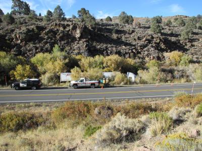 Photo of overturned big rig on side of road